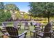 Lush green outdoor area featuring a pond with fountain, surrounded by Adirondack chairs at 900 River Vista Dr, Atlanta, GA 30339