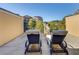 Relax on the private patio with comfortable lounge chairs and neighborhood views at 900 River Vista Dr, Atlanta, GA 30339