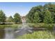 A scenic pond with a fountain and lush green surroundings, providing a peaceful community view at 900 River Vista Dr, Atlanta, GA 30339