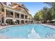 Resort-style pool with ample seating and manicured grounds at 900 River Vista Dr, Atlanta, GA 30339