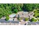 An aerial view of the community center with pool, parking, and green space at 900 River Vista Dr, Atlanta, GA 30339