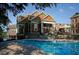 Inviting pool area with a clubhouse and lush landscaping, perfect for relaxation at 900 River Vista Dr, Atlanta, GA 30339