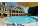 Sparkling pool featuring sun loungers and umbrellas for a resort-style experience at 900 River Vista Dr, Atlanta, GA 30339