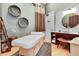 Relaxing spa room features a massage table, sink, and decorative wall art for a calming and luxurious experience at 900 River Vista Dr, Atlanta, GA 30339