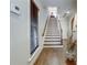 Elegant staircase with hardwood floors and natural light streaming through the window at 900 River Vista Dr, Atlanta, GA 30339