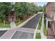 Street view of townhomes with mature trees and manicured lawns in community at 900 River Vista Dr, Atlanta, GA 30339