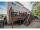 Back deck with outdoor seating and stairs leading to a gravel yard at 1384 Doublegate Dr, Brookhaven, GA 30319