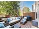 Outdoor deck area with wicker furniture and a gas grill at 1384 Doublegate Dr, Brookhaven, GA 30319