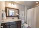 Bathroom featuring a modern vanity with a wood-framed mirror and neutral wall paint at 1384 Doublegate Dr, Brookhaven, GA 30319