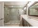 Bathroom featuring a large glass enclosed shower and double sink vanity at 1384 Doublegate Dr, Brookhaven, GA 30319