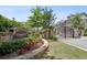 Gated entrance to Townsend at Lenox Park with stone wall and manicured landscaping at 1384 Doublegate Dr, Brookhaven, GA 30319