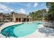 Community pool with lounge chairs and a covered pavilion for residents at 1384 Doublegate Dr, Brookhaven, GA 30319