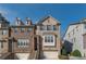 Beautiful brick townhome with two-car garage, covered entry, and multiple windows at 1384 Doublegate Dr, Brookhaven, GA 30319