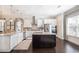 Open kitchen boasts an island, stainless steel appliances, and dark hardwood floors at 1384 Doublegate Dr, Brookhaven, GA 30319