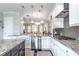 Updated kitchen showcasing granite countertops, stainless appliances, and ample cabinet space at 1384 Doublegate Dr, Brookhaven, GA 30319