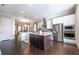 Bright, spacious kitchen with stainless steel appliances, island, and modern fixtures at 1384 Doublegate Dr, Brookhaven, GA 30319