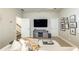 Spacious living room with neutral decor, a large TV, and comfortable seating at 1384 Doublegate Dr, Brookhaven, GA 30319