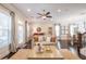Bright living room with dark wood floors, neutral walls, and large windows at 1384 Doublegate Dr, Brookhaven, GA 30319