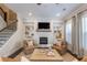 Cozy living room with fireplace, built-in shelving, and comfortable seating arrangement at 1384 Doublegate Dr, Brookhaven, GA 30319