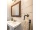 Charming powder room with shiplap walls, pedestal sink, and industrial towel bar at 1384 Doublegate Dr, Brookhaven, GA 30319