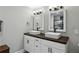 Bathroom features double sink vanity with vessel sinks, hardwood countertop and modern fixtures at 1865 Lochlomand Se Ln, Smyrna, GA 30080