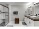 Bathroom boasts a glass-enclosed shower and a double sink vanity with vessel sinks at 1865 Lochlomand Se Ln, Smyrna, GA 30080