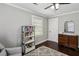 Bedroom with hardwood floors and dresser and shelves offering ample storage at 1865 Lochlomand Se Ln, Smyrna, GA 30080