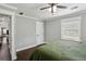 Bedroom with hardwood floors, white door, grey walls and natural light from the window at 1865 Lochlomand Se Ln, Smyrna, GA 30080
