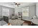 Cozy Bedroom with hardwood floors, soft rug, rocking chair, and plenty of natural light at 1865 Lochlomand Se Ln, Smyrna, GA 30080