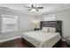 Serene bedroom with a wooden headboard, neutral bedding, hardwood floors, and plenty of natural light at 1865 Lochlomand Se Ln, Smyrna, GA 30080