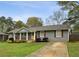 Charming single-story home with a welcoming front porch and well-maintained landscaping at 1865 Lochlomand Se Ln, Smyrna, GA 30080