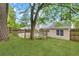Wide view of home's green backyard and spacious deck, perfect for outdoor enjoyment at 2199 Summertown Dr, Norcross, GA 30071