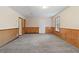 Basement room featuring carpet and wood paneling, perfect for versatile use and comfort at 2199 Summertown Dr, Norcross, GA 30071