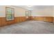 Basement room featuring carpet and wood paneling, perfect for versatile use and comfort at 2199 Summertown Dr, Norcross, GA 30071