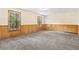 Large finished basement with gray carpet and wood paneling at 2199 Summertown Dr, Norcross, GA 30071