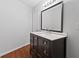 Bathroom with dark vanity, white countertop and stainless steel faucet, providing a modern touch at 2199 Summertown Dr, Norcross, GA 30071