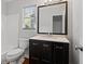 This bathroom features a dark wood vanity with granite countertops and a shower-tub combination at 2199 Summertown Dr, Norcross, GA 30071