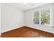 Comfortable bedroom with bright window, hardwood flooring and neutral walls at 2199 Summertown Dr, Norcross, GA 30071