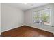 Bedroom featuring wood-look flooring and a bright window letting in natural light at 2199 Summertown Dr, Norcross, GA 30071