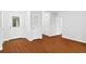 The entryway has wood floors, white walls, and multiple white doors at 2199 Summertown Dr, Norcross, GA 30071