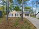 Cozy single-story home with a well-manicured lawn and mature trees offering shade and curb appeal at 2199 Summertown Dr, Norcross, GA 30071