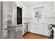 Bright kitchen with stainless steel appliances, white cabinets, and modern countertops at 2199 Summertown Dr, Norcross, GA 30071