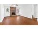 Living room with hardwood floors, stone fireplace, ceiling fan, and bright white walls at 2199 Summertown Dr, Norcross, GA 30071