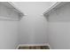 Empty walk-in closet features new vinyl floors and shelving, providing ample storage space at 2199 Summertown Dr, Norcross, GA 30071