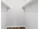 Spacious walk-in closet with ample shelving and hardwood floors at 2199 Summertown Dr, Norcross, GA 30071