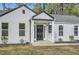 Charming home featuring a symmetrical design with a covered entry and manicured landscaping at , Atlanta, GA 30311