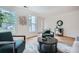 Living room with hardwood floors, several windows, and decorated with modern decor at , Atlanta, GA 30311
