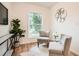 Inviting sitting area with two chairs, cowhide rug, and hardwood floors with natural light at , Atlanta, GA 30311