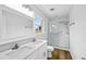 Updated bathroom with double vanity, quartz countertop, and glass-enclosed shower at 240 Thornton Dr, Fayetteville, GA 30214