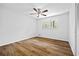 Bedroom features a ceiling fan, window, and wood-look floors at 240 Thornton Dr, Fayetteville, GA 30214